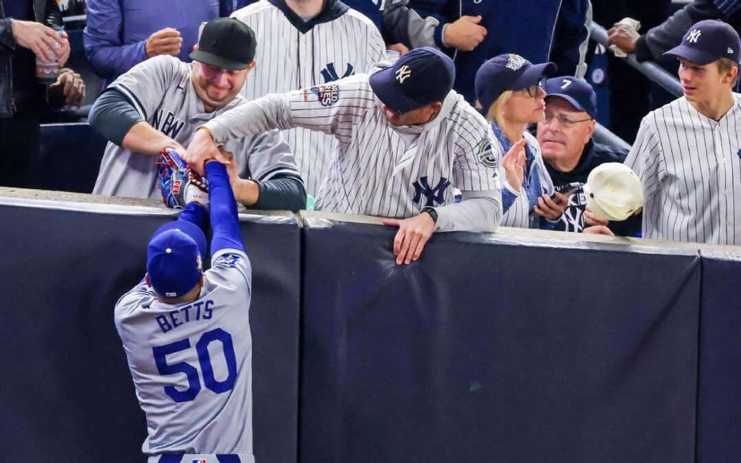 Two fans ejected for prying ball from Betts’ glove​