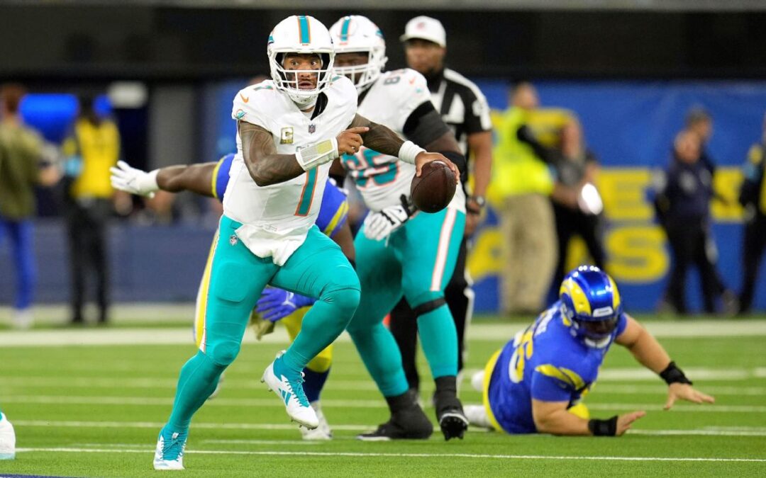 Tua and the Dolphins keep playoff hopes alive in win vs. Rams​